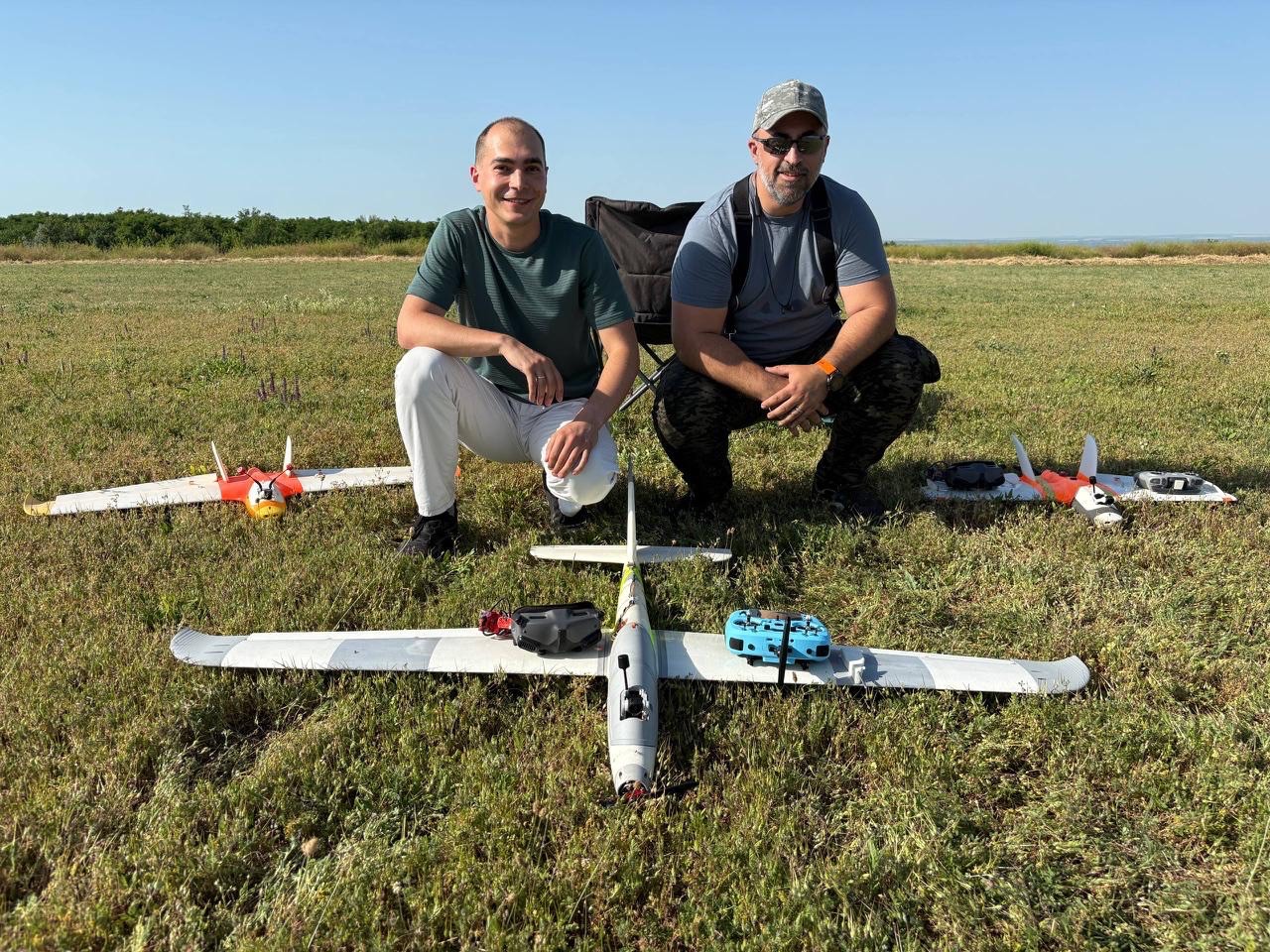 Stella Aerospace team in the field with three 3D-printed fixed-wing test aircraft
